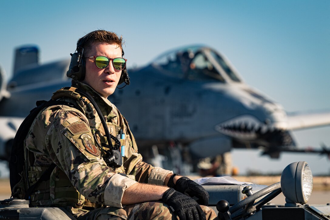 Photo of an Airman operating a weapons loader