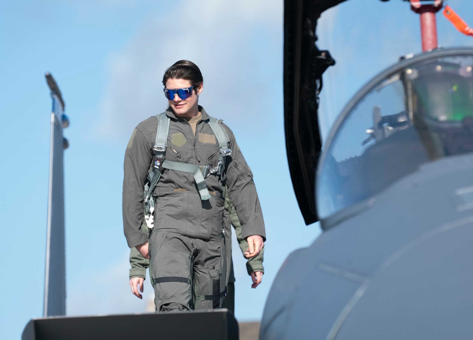 U.S. Air Force Senior Airman Joseph Robinson, 48th Aircraft Maintenance Squadron dedicated crew chief, prepares to enter the cockpit of an F-15E Strike Eagle for an orientation flight at Royal Air Force Lakenheath, England, Feb. 26, 2021. Orientation flights provide an opportunity for AMXS Airmen to become more familiar with the aircraft in their care and its capabilities, as well as the 48th Fighter Wing mission. (U.S. Air Force photo by Airman 1st Class Jessi Monte)