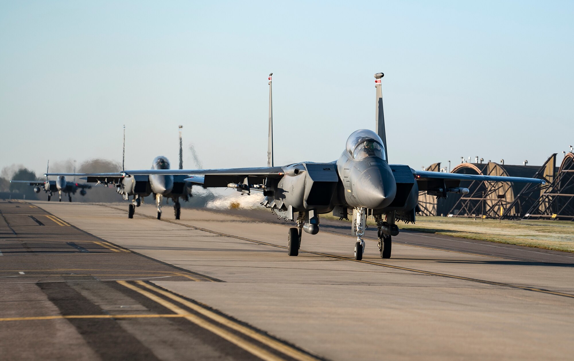 F-15E Strike Eagles taxi to the runway for the first wave of orientation flights at Royal Air Force Lakenheath, England, Feb. 26, 2021. Orientation flights are offered to those who have responsibilities related to aviation and aircraft or as an award to individuals who show exceptional performance in their duties. (U.S. Air Force photo by Airman 1st Class Jessi Monte)