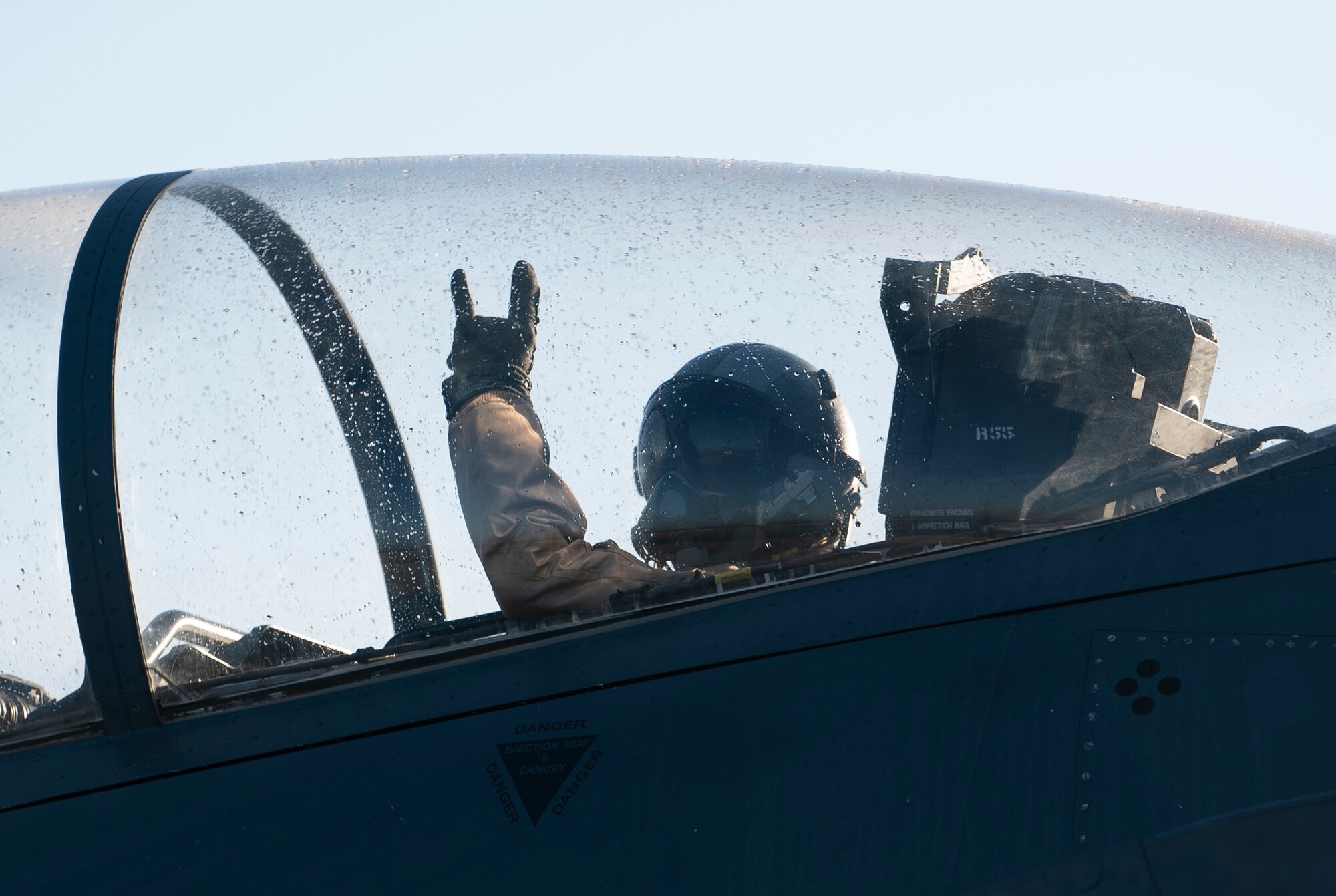 U.S. Air Force Staff Sgt. Gabriel Roth, 48th Aircraft Maintenance Squadron dedicated crew chief, waves as he taxis toward the runway for an orientation flight at Royal Air Force Lakenheath, England, Feb. 26, 2021. Orientation flights provide an opportunity for AMXS Airmen to become more familiar with the aircraft in their care and its capabilities, as well as the 48th Fighter Wing mission. (U.S. Air Force photo by Airman 1st Class Jessi Monte)