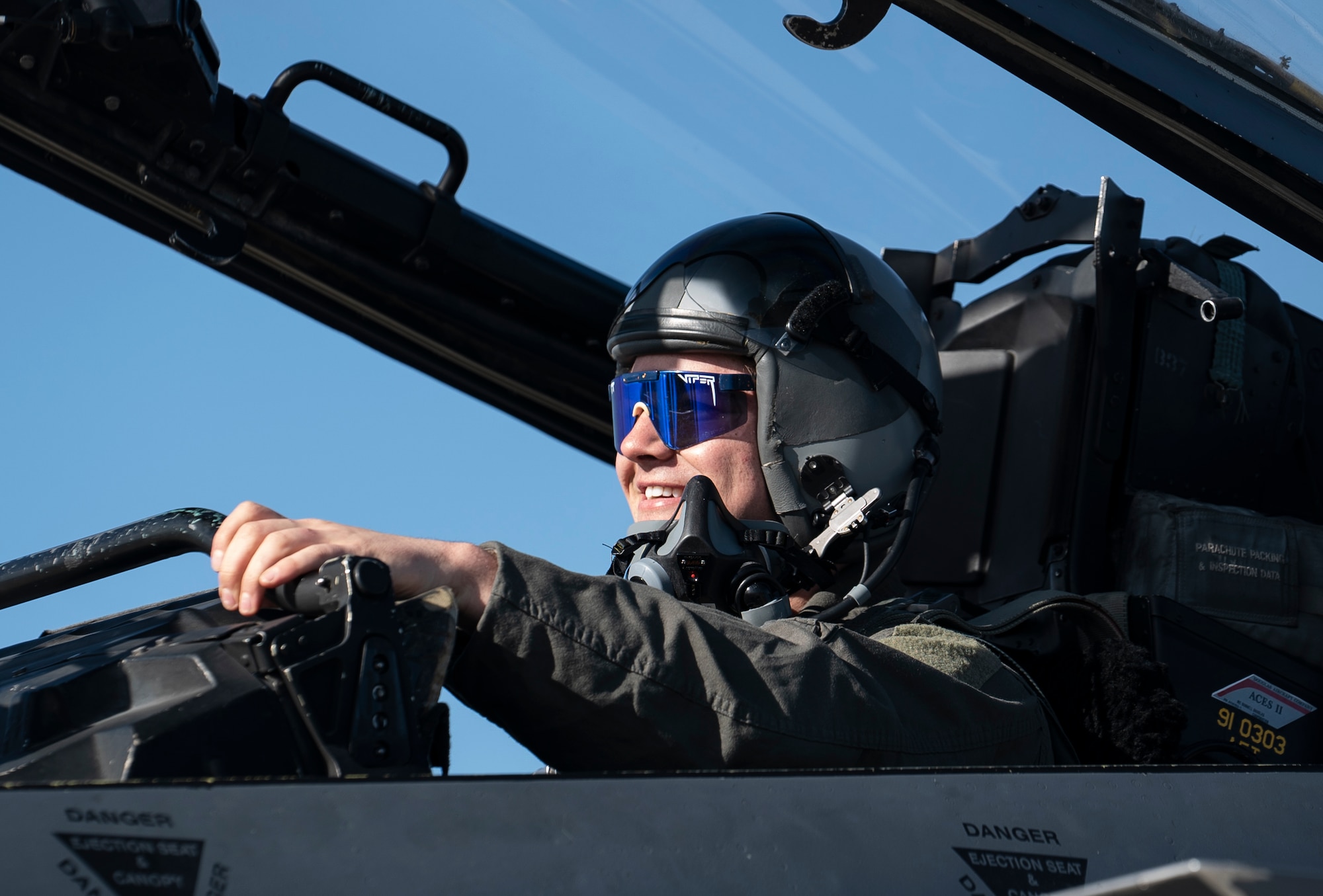 U.S. Air Force Senior Airman Joseph Robinson, 48th Aircraft Maintenance Squadron dedicated crew chief, sits in the cockpit of an F-15E Strike Eagle for an orientation flight at Royal Air Force Lakenheath, England, Feb. 26, 2021. Orientation flights provide an opportunity for AMXS Airmen to become more familiar with the aircraft in their care and its capabilities, as well as the 48th Fighter Wing mission. (U.S. Air Force photo by Airman 1st Class Jessi Monte)
