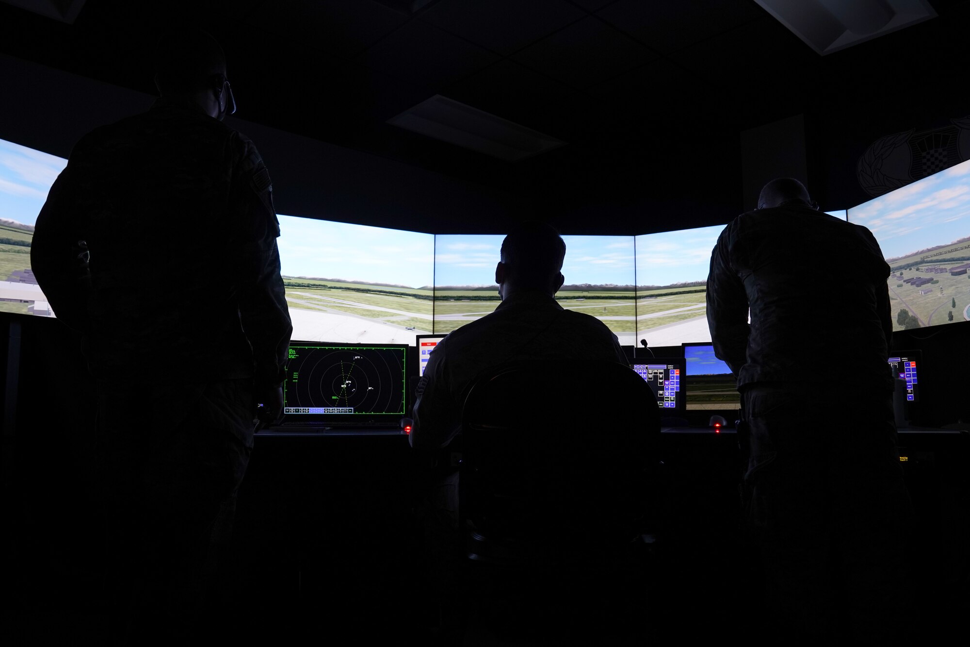 U.S. Air Force Tech. Sgts. Dereck Padgett, Kyle Hayes, and Dustin Brannan, 334th Training Squadron air traffic control instructors, practice air traffic simulations inside Cody Hall at Keesler Air Force, Mississippi, March 4, 2020. The instructors were selected to be a part of the Air Education and Training Command Air Traffic Control Rapid Response Team, initiated to combat the potential loss of manning due to COVID-19. (U.S. Air Force photo by Senior Airman Seth Haddix)