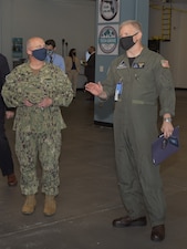 ORLANDO, Fla. (March 4, 2021) Chief of Naval Operations Adm. Mike Gilday, listens as Naval Air Warfare Center Training Systems Division (NAWCTSD) Commanding Officer, Capt. Tim Hill explains the purpose of the newly-opened Central Florida Tech Grove. The Tech Grove is a facility designed to foster technical collaboration between military training systems commands, academia and Central Florida’s technology industries. NAWCTSD is the Navy's principal center for modeling, simulation, and training systems technologies. The command develops training systems for all of the Navy's warfare areas. (U.S. Navy Photo by Doug Schaub)