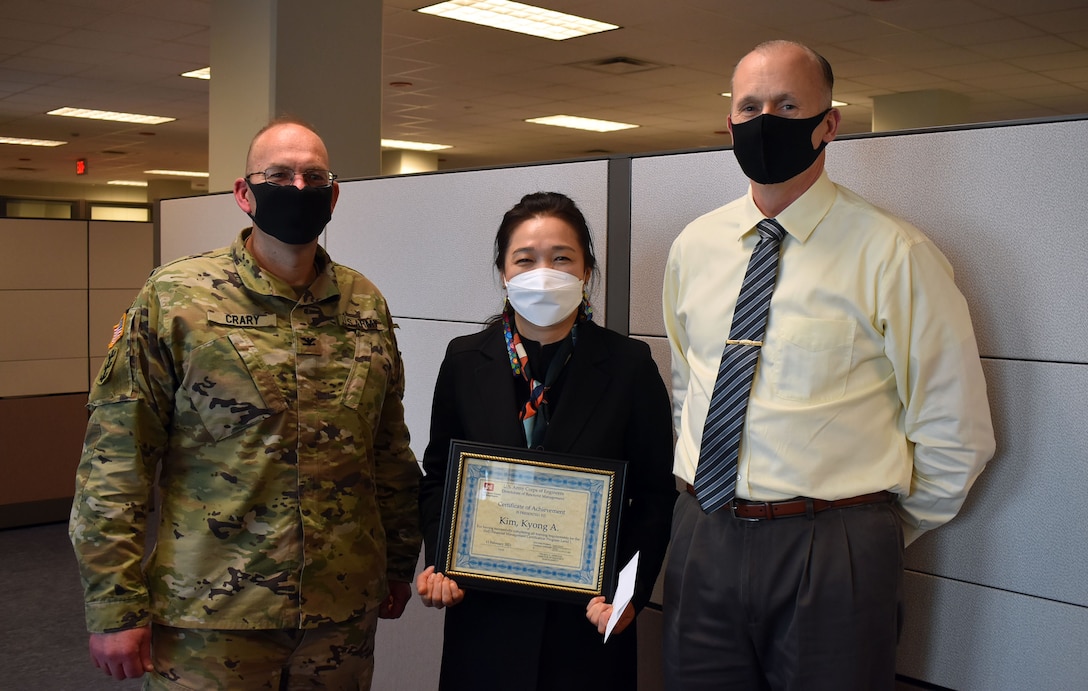 Program Analyst, KyongA Kim (middle), was recognized at the U.S. Army Corps of Engineers (USACE) Far East District (FED) Headquarters by Col. Christopher Crary (left), USACE FED commander, and Richard Byrd (right), USACE FED deputy district engineer, for being the first Korean National employee to receive the DoD Financial Management Level 1 certification. This is the first time a Local National employee has earned this certification and been recognized by USACE Headquarters and the DoD, as a whole.