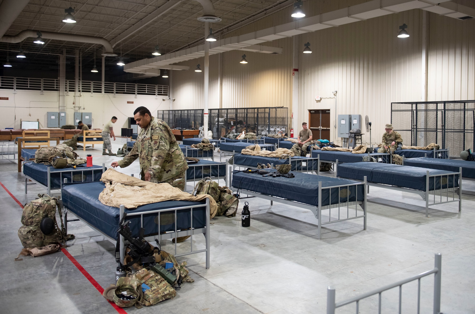Photo of Airmen setting up beds
