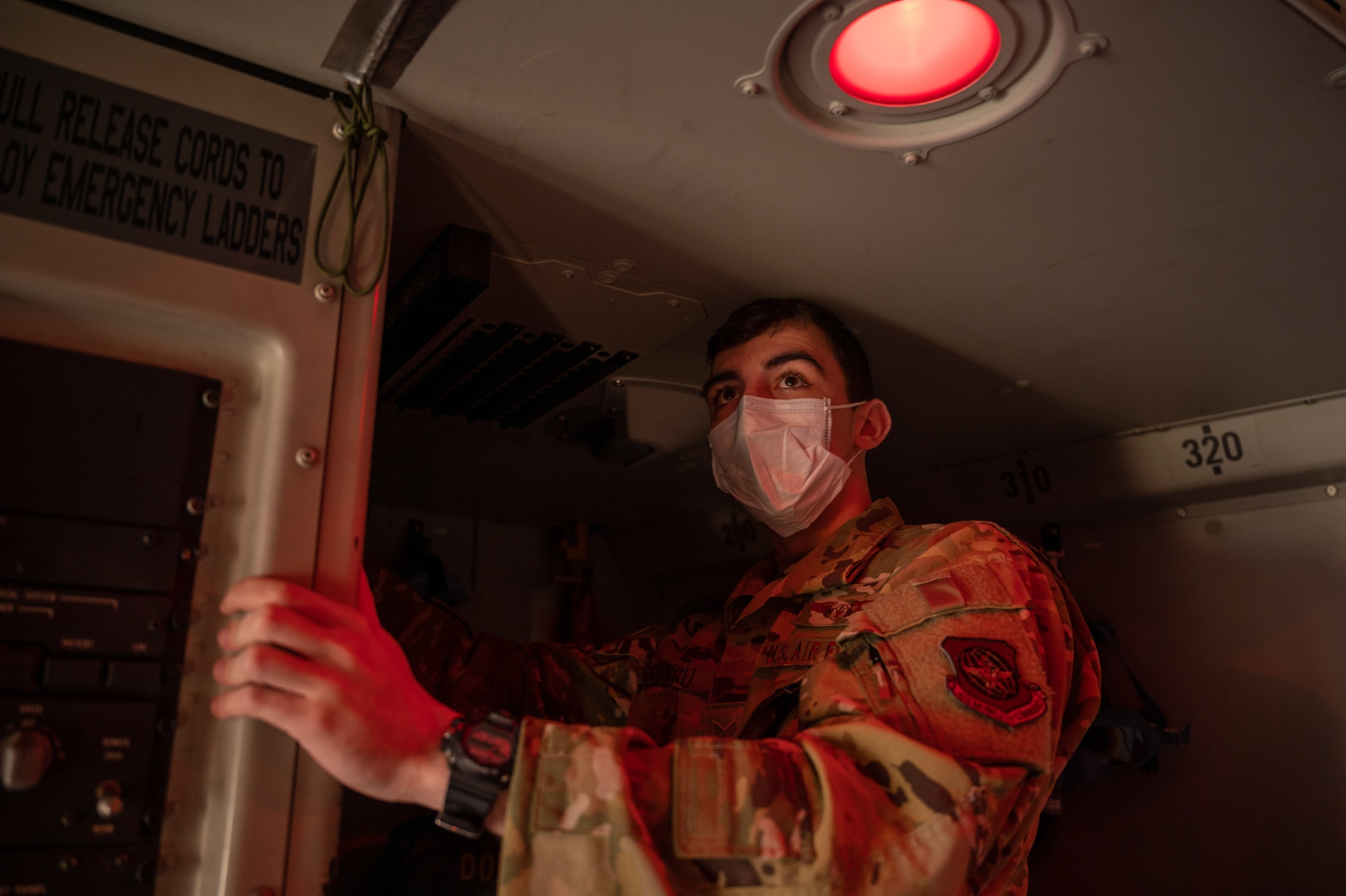 Senior Airman Jackson Pickrel tests emergency lights on a Dover Air Force Base C-17 Globemaster III before takeoff during exercise Mosaic Tiger at Moody AFB, Georgia, Feb. 25, 2021. Airmen from Dover AFB and Joint Base McGuire-Dix Lakehurst, New Jersey participated in the exercise, led by the 23rd Wing at Moody AFB, Georgia. The exercise tested agile combat employment  to build mission-essential skills to support the needs of Air Combat Command and Air Mobility Command. (U.S. Air Force photo by Airman 1st Class Faith Schaefer)