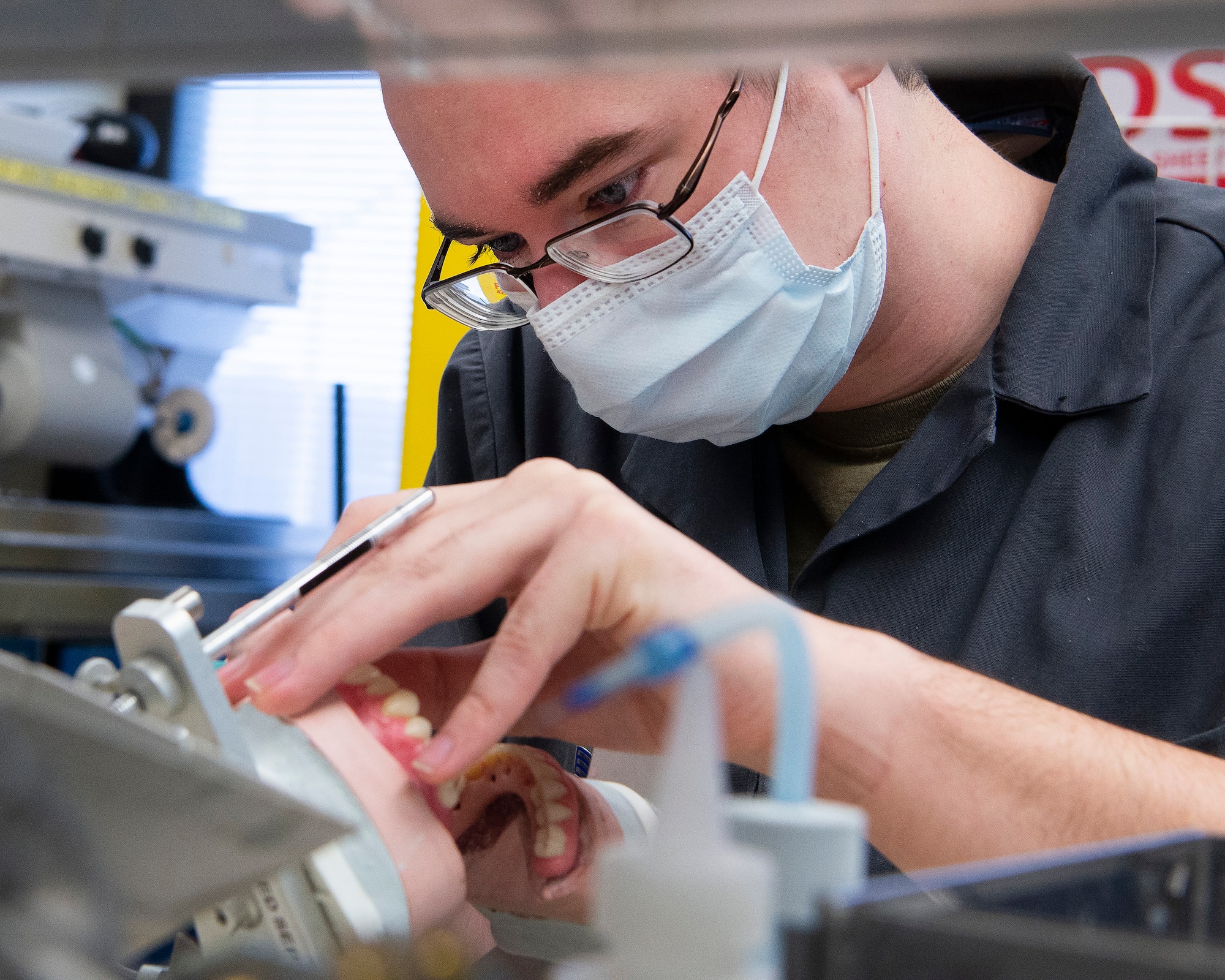 U.S. Air Force Senior Airman Nicholas Carter, 88th Dental Squadron dental laboratory technician, creates a set of dentures Feb. 22, 2021, in the dental clinic lab at Wright-Patterson Air Force Base, Ohio. Carter and other technicians make the prosthetics ordered by the clinic’s dentists . (U.S. Air Force photo by R.J. Oriez)