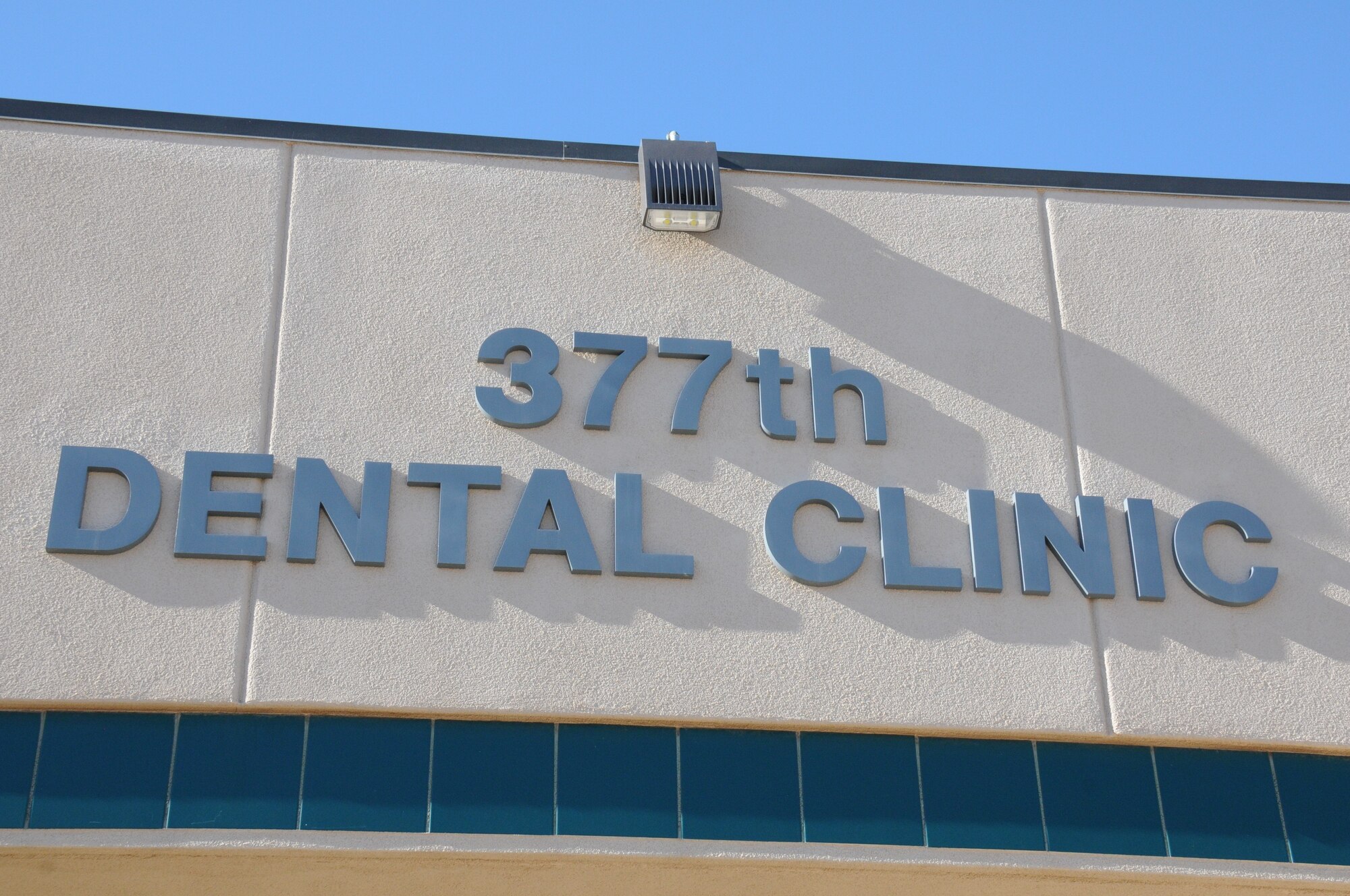 Photo of exterior dental clinic building identification.