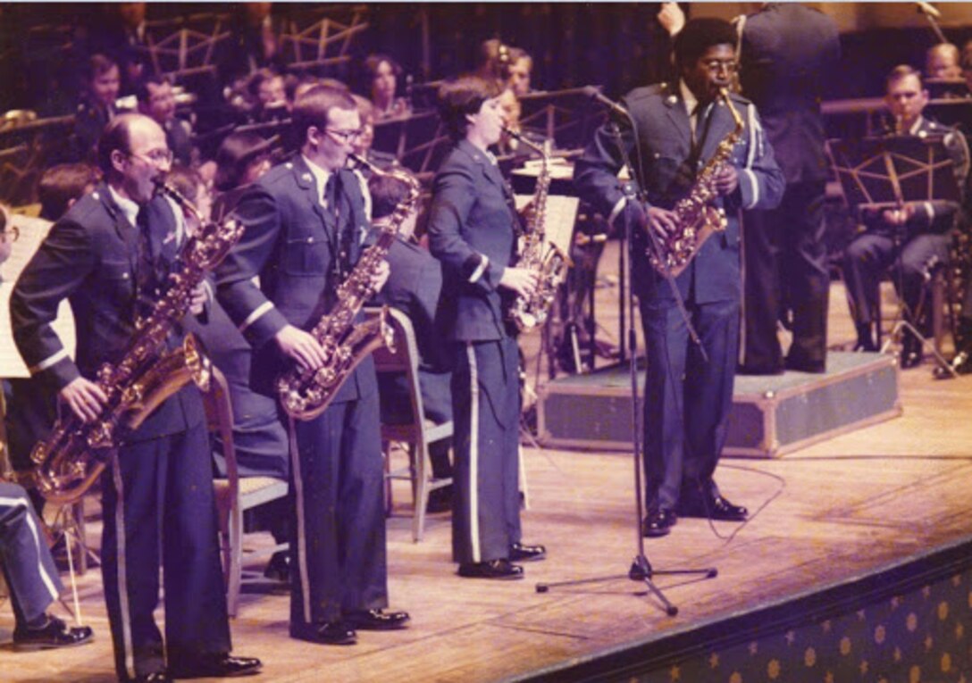 The sax section joins soloist Chief Master Sgt. James Scott at the front of the stage during a performance of Jerry Bilik's "Rhapsody & Variations" at Constitution Hall in 1980.