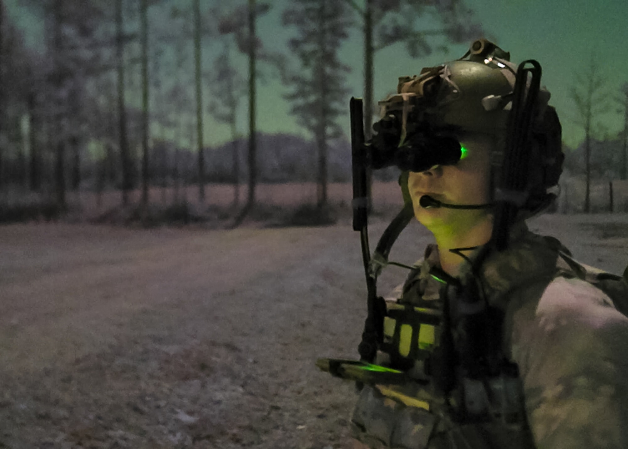 A U.S. Air Force Special Tactics operator assigned to the 24th Special Operations Wing surveys an exercise mission zone during Emerald Warrior 21.1, Feb. 22, 2021, at Camp Shelby, Mississippi. Emerald Warrior is the largest joint special operations exercise involving U.S. Special Operations Command forces training to respond to various threats across the spectrum of conflict. (U.S. Air Force photo by Staff Sgt. Gabriel Macdonald)
