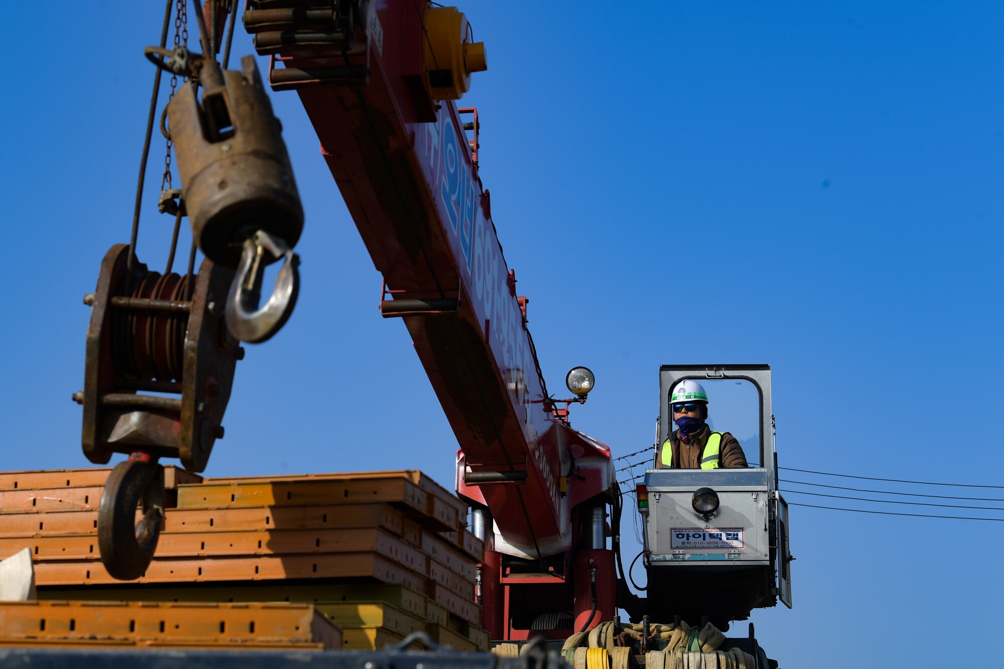 Local construction workers begin teardown of the main gate at Osan Air Base, Republic of Korea March 5, 2021. The old structures were removed in order for the newly renovated gate, due to be completed by October. (U.S. Air Force photo by Senior Airman Noah Sudolcan)