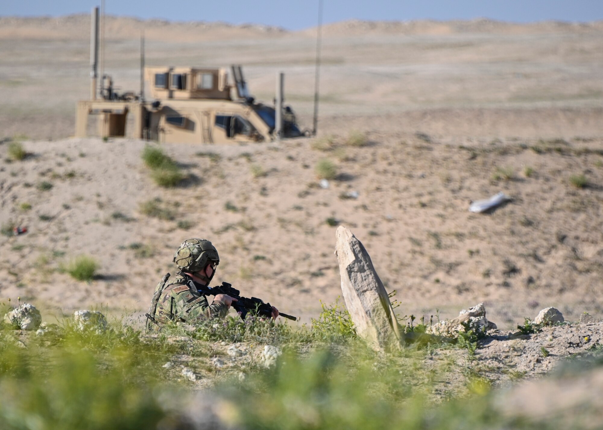 A photo of an Airman holding a gun