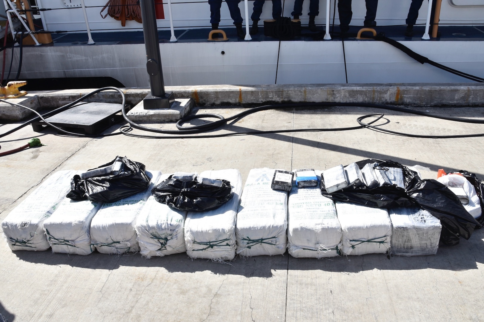 Bales of cocaine sit on the deck of Coast Guard Cutter Heriberto Hernandez.