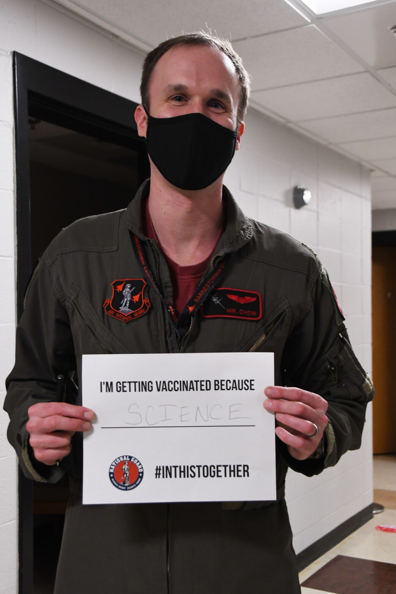U.S. Air Force Maj. Mark 'Mr. Chow' Silvers, a pilot with the 131st Fighter Squadron, poses for a photo after receiving his COVID-19 vaccination at the base clinic Feb. 5, 2021. Barnestormers have been stepping up to fight the COVID-19 pandemic by volunteering to get vaccinated.(U.S. Air National Guard photo by Staff Sgt. Hanna Smith)