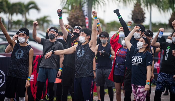 Contestants participating in the Okinawa Spartan Race motivate each other before beginning the race on Chura Sun Beach, Okinawa, Japan, Feb. 27.