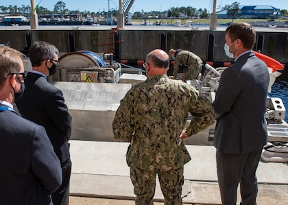 Dr. Peter Adair (far left), technical director at Naval Surface Warfare Center Panama City Division discuss unmanned systems with NSWC PCD engineers Evan McCaw (left), Ricky McNaron (right) , and Adm. Mike Gilday (center), Chief of Naval Operations, March 4.
