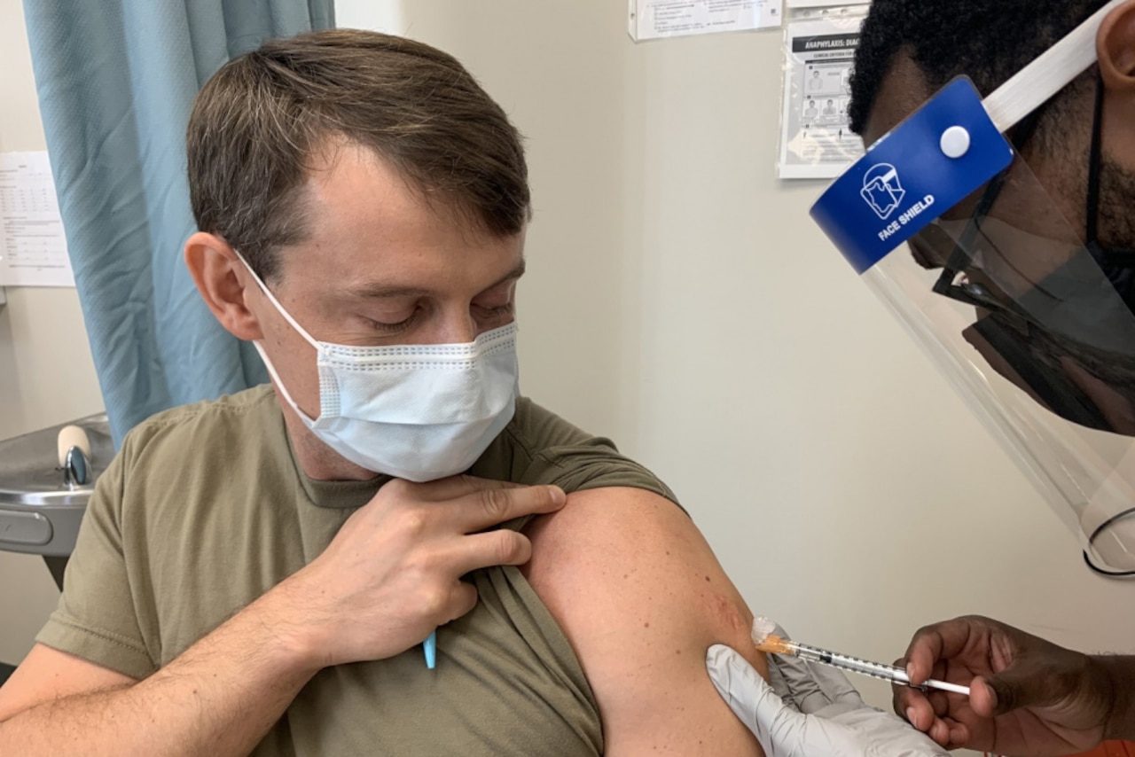 A soldier is vaccinated.