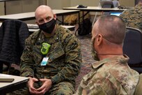 U.S. Marine Corps Lt. Col. James D. Thornburg Jr., left, commanding officer of Combat Logistics Battalion 22 (CLB-22), and U.S. Army Brig. Gen. Robert E. Suter, right, deputy surgeon with U.S. Army North, discuss vaccination operations during the opening of the state-run, federally-supported Center City Community Vaccination Center at the Pennsylvania Convention Center in Philadelphia on March 3, 2021.