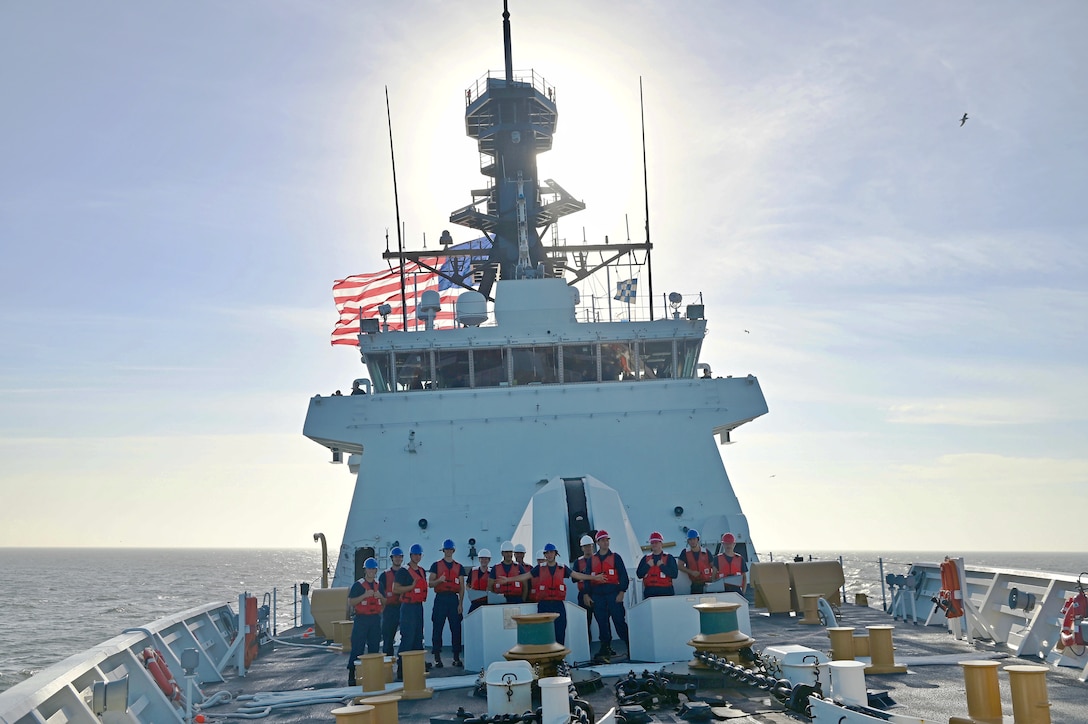 The USCGC Stone (WMSL 758) crew stand on the forward weather deck during a special sea detail.