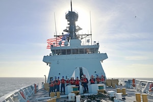 The USCGC Stone (WMSL 758) crew stand on the forward weather deck during a special sea detail.