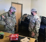 Lt. Gen. Doug Gabram (left), commanding general of Installation Management Command, speaks to a Soldier in the barracks at Fort Hood after a historic winter storm damaged the garrison. IMCOM is leading the recovery effort.