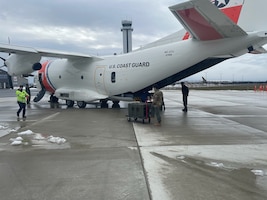 Coast Guard members fly COVID-19 vaccines around the West Coast using a C-27 Spartan aircraft