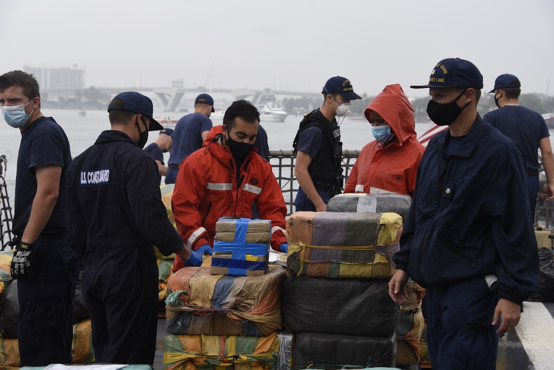 The Coast Guard Cutter Harriet Lane (WMEC-903) crew approximately offloads 11,800 pounds of cocaine and marijuana