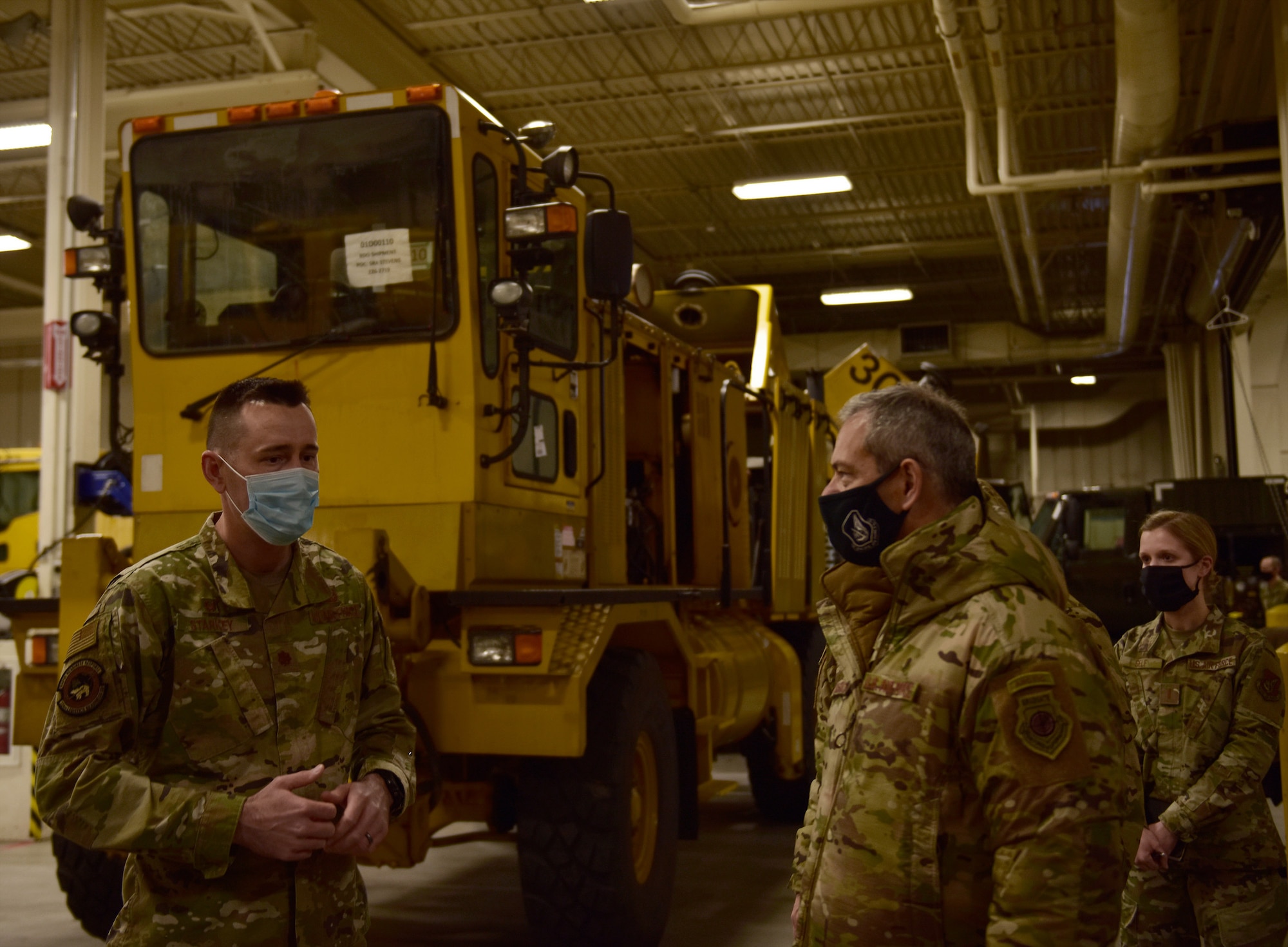 U.S. Air Force Maj. Adam Starkey, 354th Logistics Readiness Squadron (LRS) commander (left), briefs Gen. Ken. Wilsbach, Pacific Air Forces commander, on LRS Snow Fleet operations and equipment, Feb. 19, 2021, at Eielson Air Force Base, Alaska.