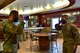 U.S. Air Force Staff Sgt. Trenton Ross, Joint Terminal Attack Controller Continuation Training manager (right), salutes Gen. Ken Wilsbach, Pacific Air Forces commander after being coined, Feb. 19, 2021 at Eielson Air Force Base, Alaska.