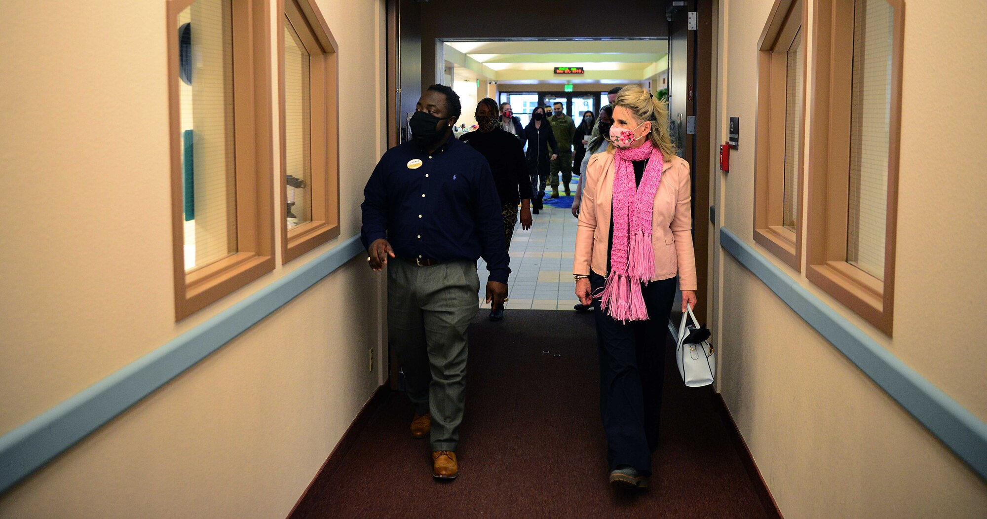 Brian Lennon, Child Development Center (CDC) assistant flight chief, guides Cindy Wilsbach, spouse of Pacific Air Forces commander Gen. Ken Wilsbach, on a tour of the CDC during a visit to Eielson Air Force Base, Alaska, Feb. 19, 2021.