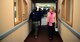Brian Lennon, Child Development Center (CDC) assistant flight chief, guides Cindy Wilsbach, spouse of Pacific Air Forces commander Gen. Ken Wilsbach, on a tour of the CDC during a visit to Eielson Air Force Base, Alaska, Feb. 19, 2021.