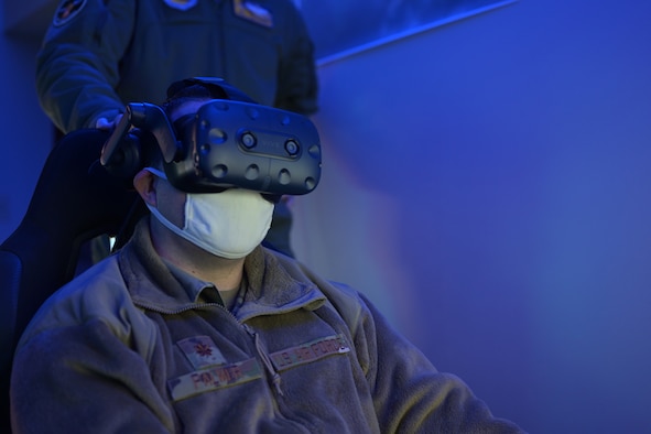 U.S. Air Force Maj. Brandon Palmer, 14th Communication Squadron commander, experiences first-hand the virtual reality training made available to student pilots at the 14th Flying Training Wing officer dorms, Feb. 12, 2021, on Columbus Air Force Base, Miss. After months of planning and coordination student pilots now have access to virtual training incorporating real-world flight footage, steps away from their dorm rooms. (U.S. Air Force photo by Airman 1st Class Jessica Haynie)