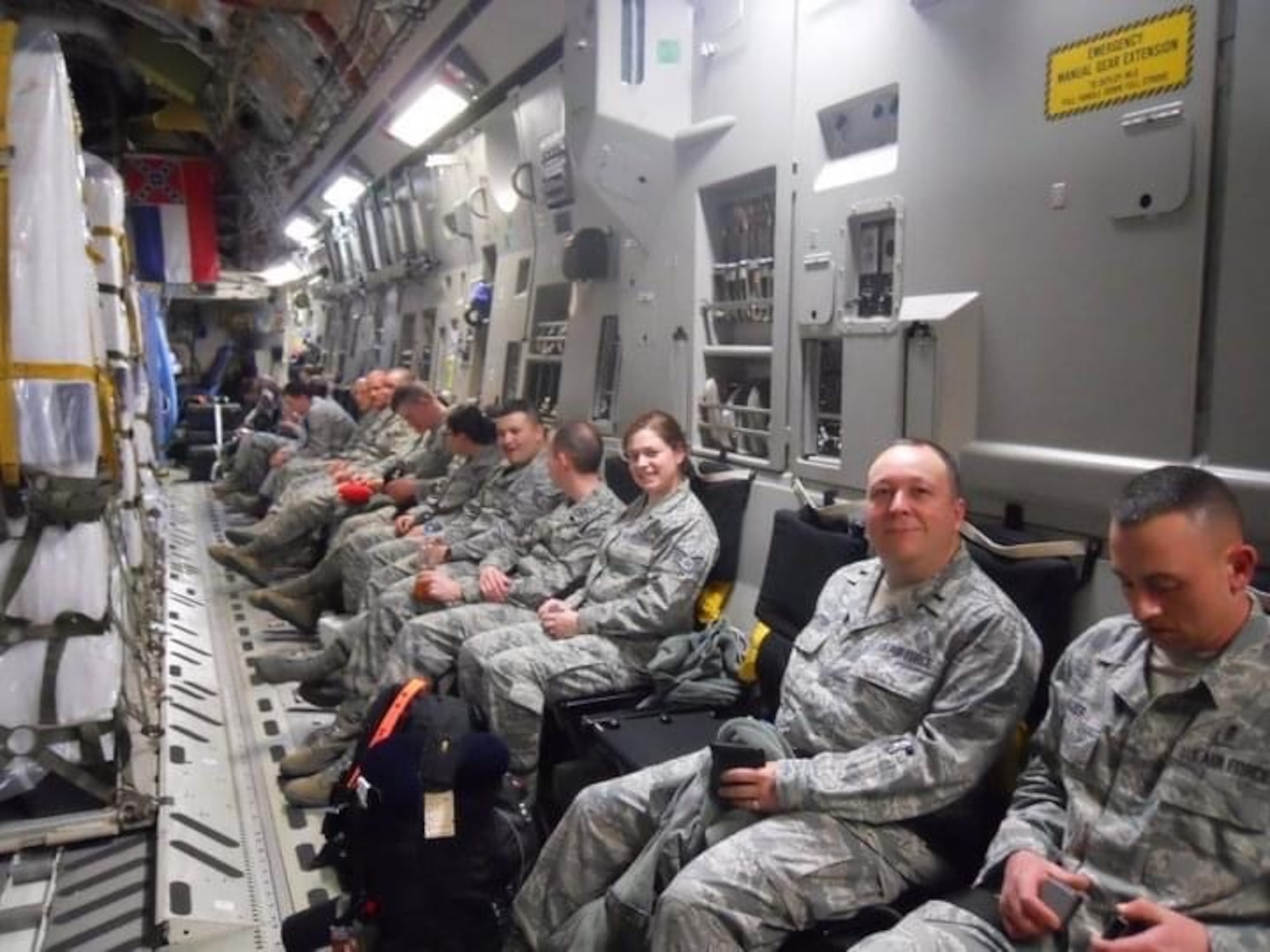 photo of Air Force Radiation Assessment Team (AFRAT) members and their equipment aboard an Air Force C-17 bound for Japan.