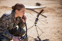 U.S. Marine Corps Lance Cpl. Marilyn Hanley, a field radio operator with Marine Medium Tiltrotor Squadron (VMM) 165 (Reinforced), 11th Marine Expeditionary Unit (MEU), conducts radio checks with various aircraft during Realistic Urban Training (RUT) at Marine Corps Air Station Yuma, Arizona, Feb. 17, 2021. RUT is the final shore-based predeployment exercise for the 11th MEU and provides an opportunity to train and execute operations in an urban environment. (U.S. Marine Corps photo by Cpl. Seth Rosenberg)