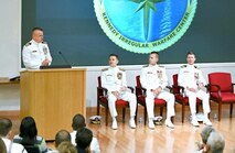 Capt. Charles (left) speaks to the audience during the Kennedy ceremony. Also picture d are ONI Commander Rear Adm. Price and Rear Adm. Okon