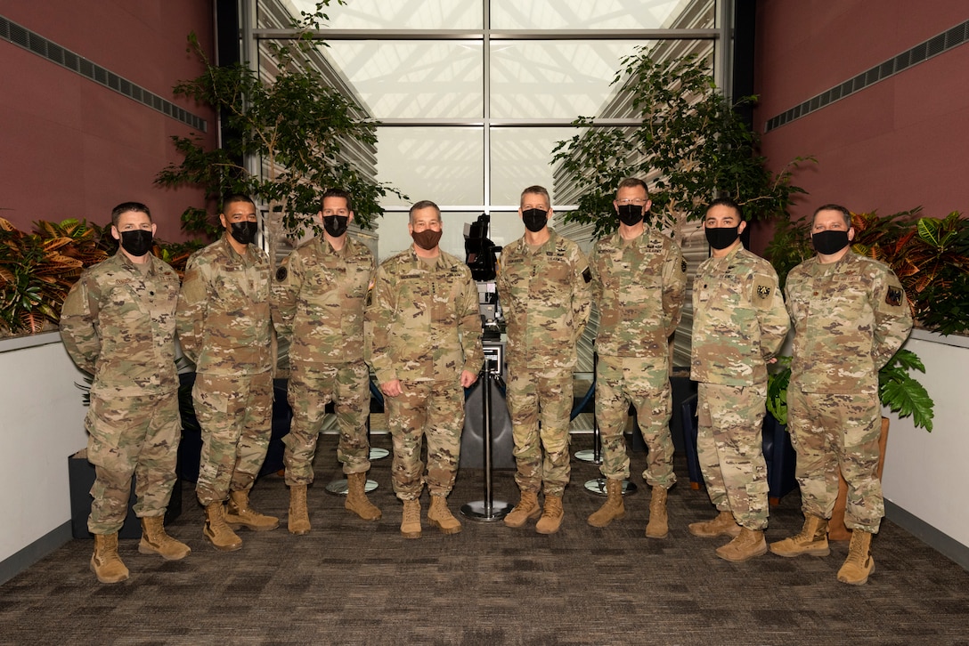 National Guard service members assigned to U.S. Space Command pose with the National Guard bureau chief.