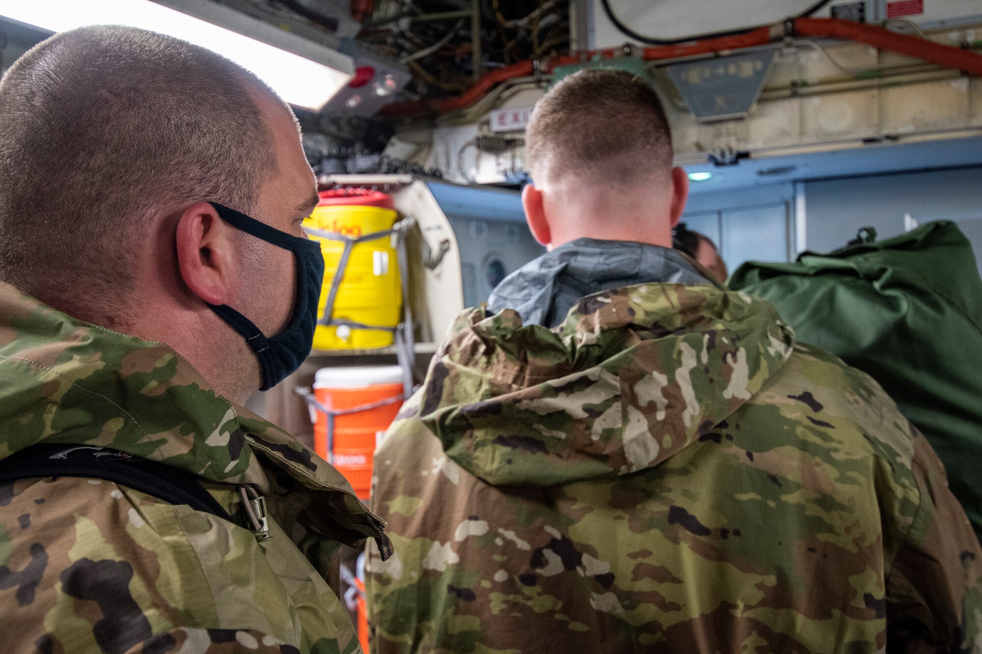 Two airmen from the 187th Fighter Wing prepare to disembark a C-17 Globemaster as part of a rapid deployment exercise in Dothan, Ala., March 1, 2021.