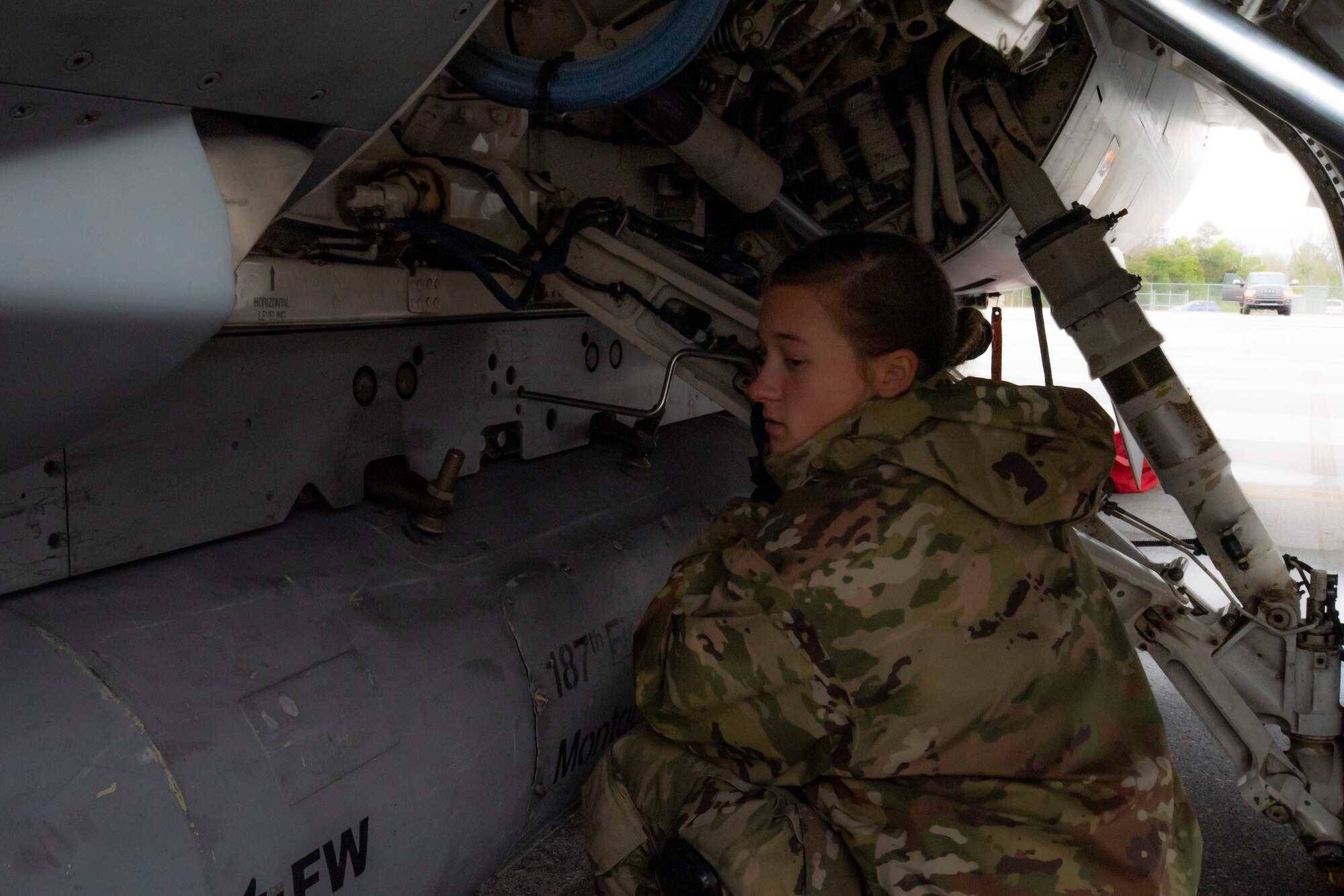 A crew chief with the 187th Fighter Wing works on an F-16 as part of a rapid deployment exercise in Dothan, Ala., March 3, 2021.
