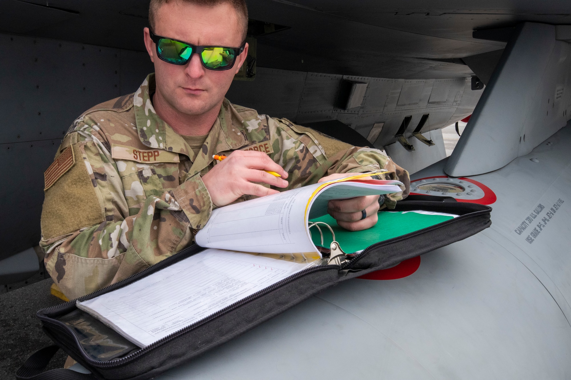 A crew chief from the 187th Fighter Wing works on an F-16C+ Fighting Falcon as part of a rapid deployment exercise in Dothan, Ala., March 3, 2021. D