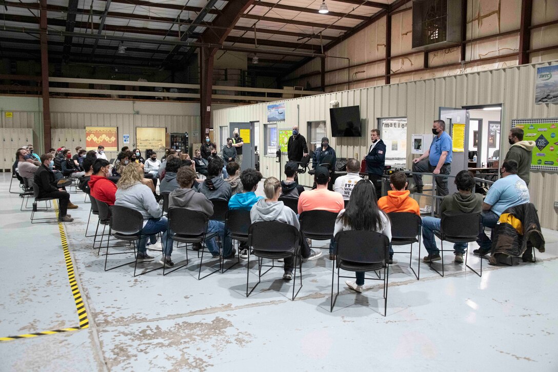 people sit in chairs