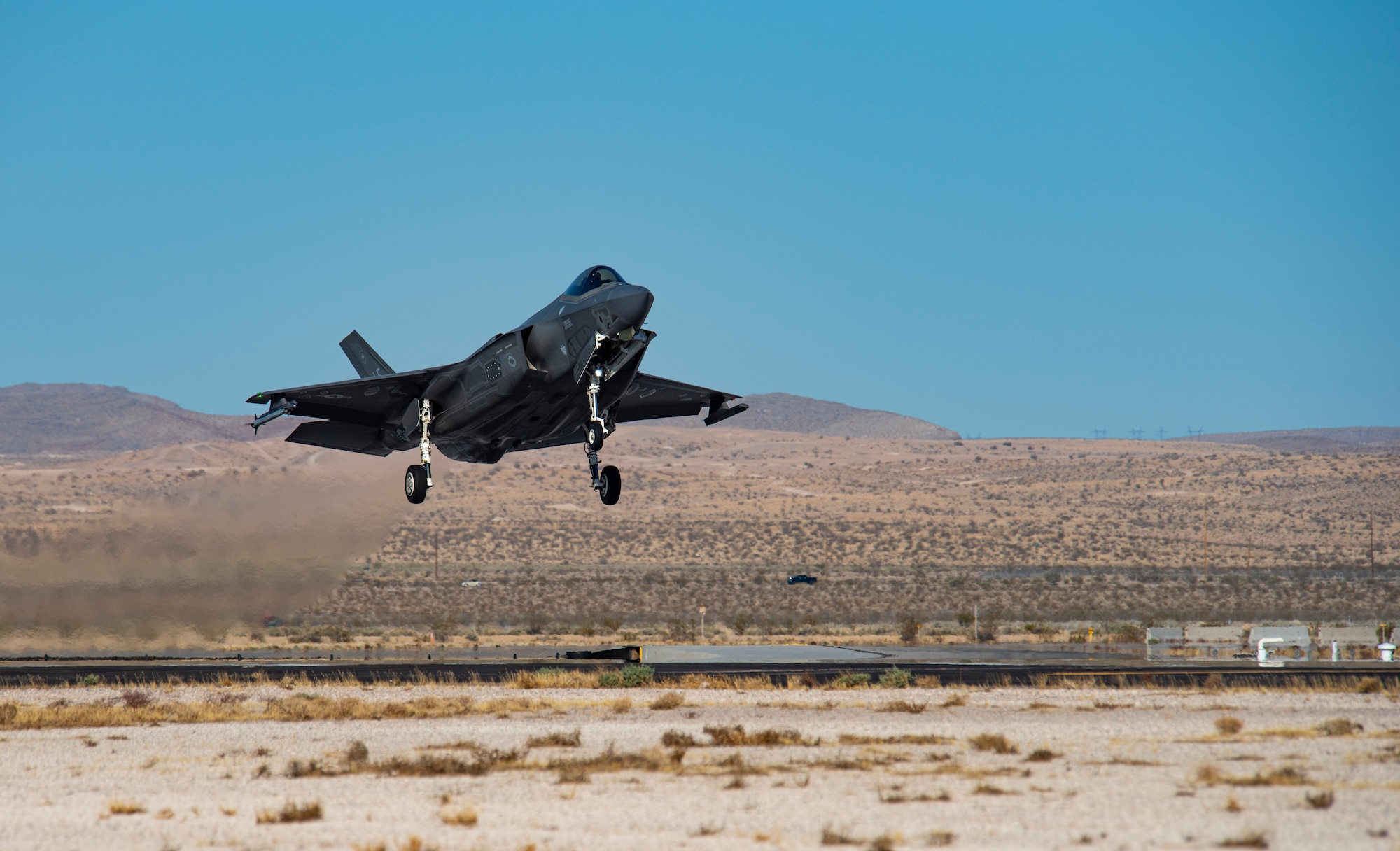 Aircraft lands on the flight line.