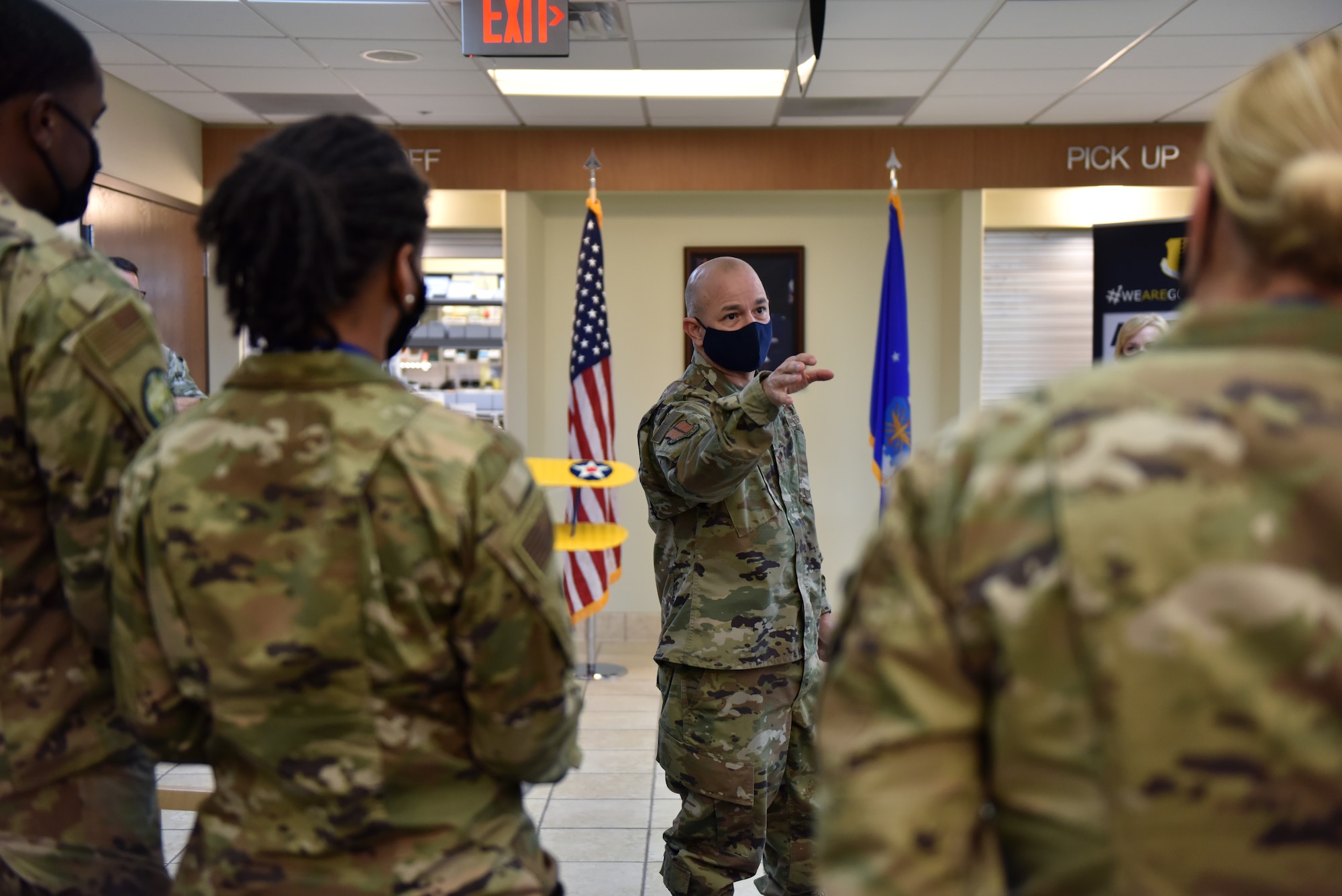 U.S. Air Force Col. Andres Nazario, 17th Training Wing commander, speaks at the Ross Clinic about rising to the challenge of COVID-19 after presenting the 17th TRW 2020 Annual Awards on Goodfellow Air Force Base, Texas, March 5, 2021. Several members from the 17th Medical Group won annual awards. (U.S. Air Force photo by Staff Sgt. Seraiah Wolf)