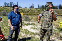 Lt. Col. Timothy Pochop, director, Environmental Compliance and Protection Division, Marine Corps Base Hawaii, speaks to State Representative Matthew LoPresti (Hawaii – District 41), during a visit and tour of Pu’uloa Range Training Facility, Hawaii, March 3, 2021. The engagement, hosted by Marine Corps Base Hawaii staff, aimed to provide information about the important training conducted at Pu’uloa Range Training Facility and to ensure comprehensive understanding regarding the shoreline stabilization options being considered to support range activity. (U.S. Marine Corps photo by Lance Cpl. Samantha Sanchez)