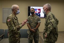 U.S. Army Lt. Gen. Ronald Place, left, director, Defense Health Agency, U.S. Marine Corps Col. Speros Koumparakis, center, commanding officer, Marine Corps Base Hawaii, and U.S. Navy Capt. Christopher Tepera, right, commanding officer, Navy Medicine Readiness and Training Command Pearl Harbor, discuss the future of the Naval Clinic during a tour of the Branch Health Clinic Kaneohe Bay, MCBH, Feb. 25, 2021. The purpose of the tour was to show Marine Corps Base Hawaii’s appreciation for Naval Medical’s continued support to the Marine Corps warfighters in the Pacific. (U.S. Marine Corps photo by Lance Cpl. Samantha Sanchez)
