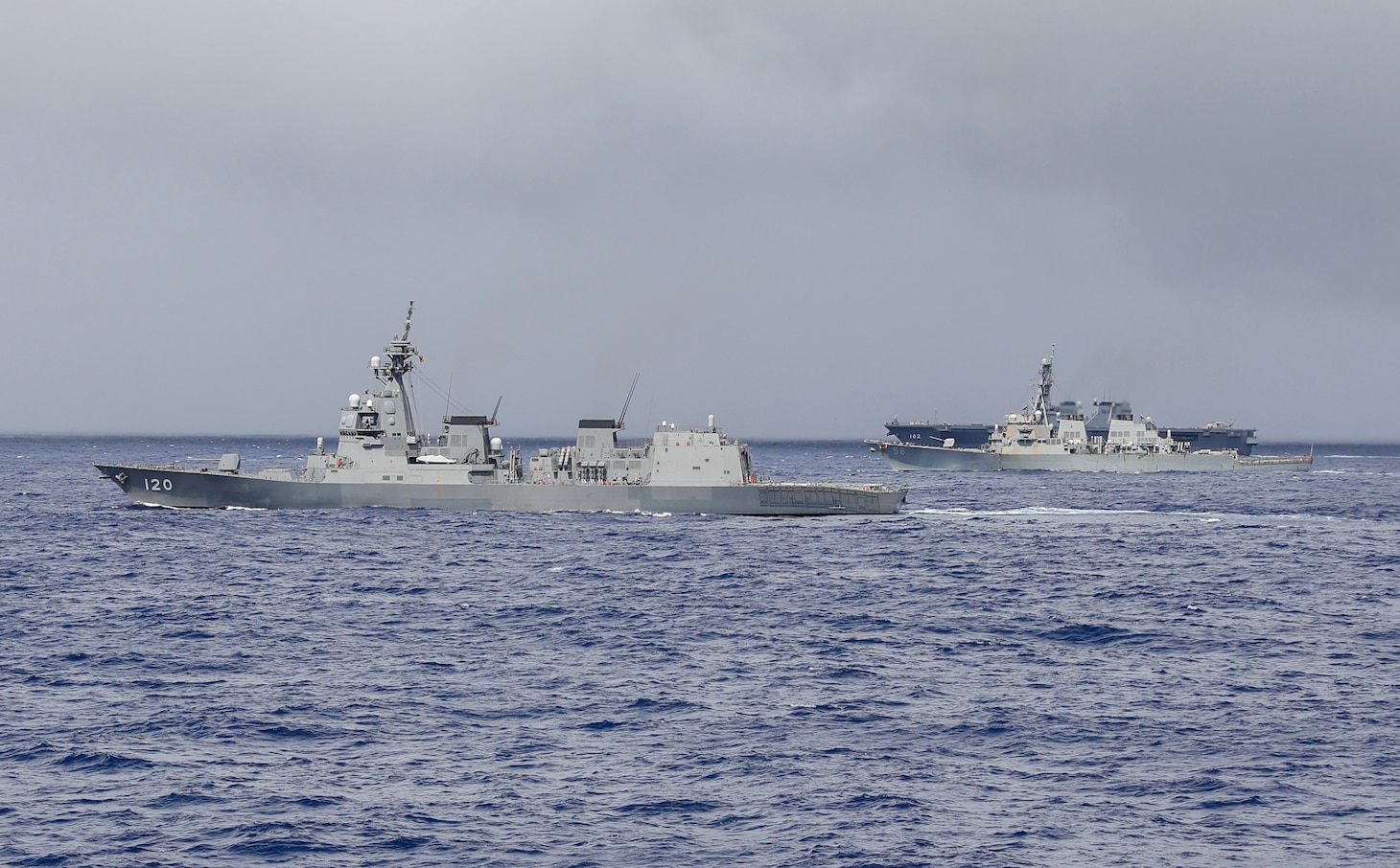 210303-N-FO714-1138 PHILIPPINE SEA (March 3, 2021) - The Arleigh Burke-class guided-missile destroyer USS John S. McCain (DDG 56), the Japan Maritime Self-Defense Force guided-missile destroyer JS Shiranui (DDG 120) and helicopter destroyer JS Ise (DDH 182) sail in formation during the annual U.S.-Japan Bilateral Advanced Warfighting Training Exercise. BAWT focuses on joint training and interoperability of coalition forces, and enables real-world proficiency and readiness in response to any contingency. (U.S. Navy photo by Mass Communication Specialist 2nd Class Deanna C. Gonzales)
