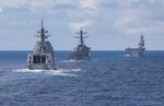 210303-N-FO714-1259 PHILIPPINE SEA (March 3, 2021) - The Arleigh Burke-class guided-missile destroyer USS John S. McCain (DDG 56), the Japan Maritime Self-Defense Force guided-missile destroyer JS Shiranui (DDG 120) and helicopter destroyer JS Ise (DDH 182) sail in formation during the annual U.S.-Japan Bilateral Advanced Warfighting Training Exercise. BAWT focuses on joint training and interoperability of coalition forces, and enables real-world proficiency and readiness in response to any contingency. (U.S. Navy photo by Mass Communication Specialist 2nd Class Deanna C. Gonzales)
