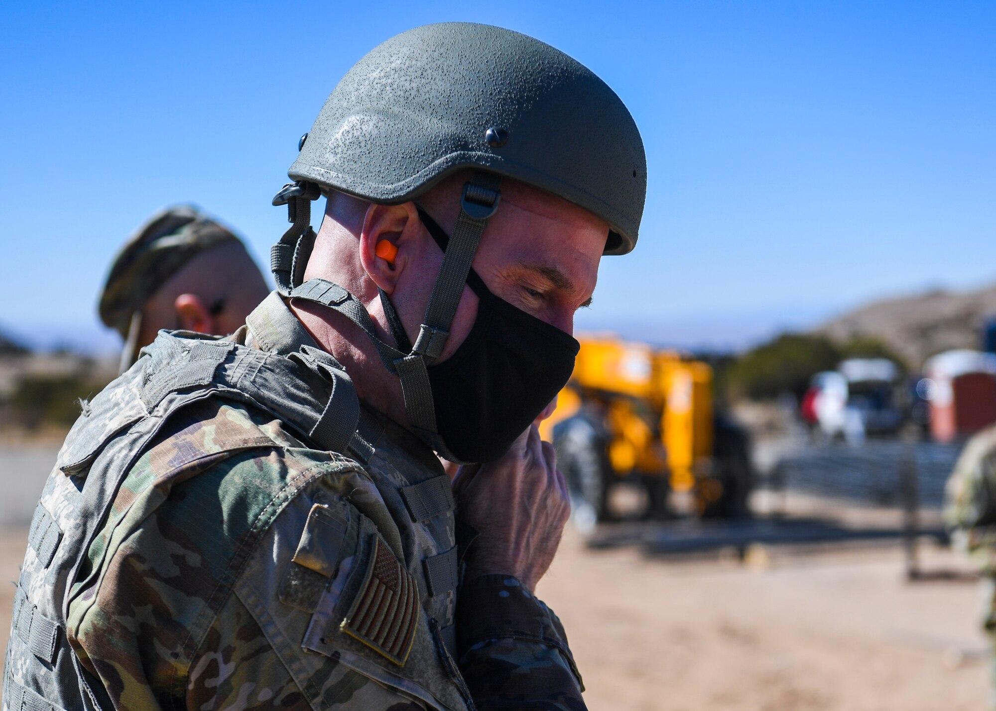 U.S. Air Force Maj. Gen. Michael J. Lutton, 20th Air Force commander, dons protective gear.