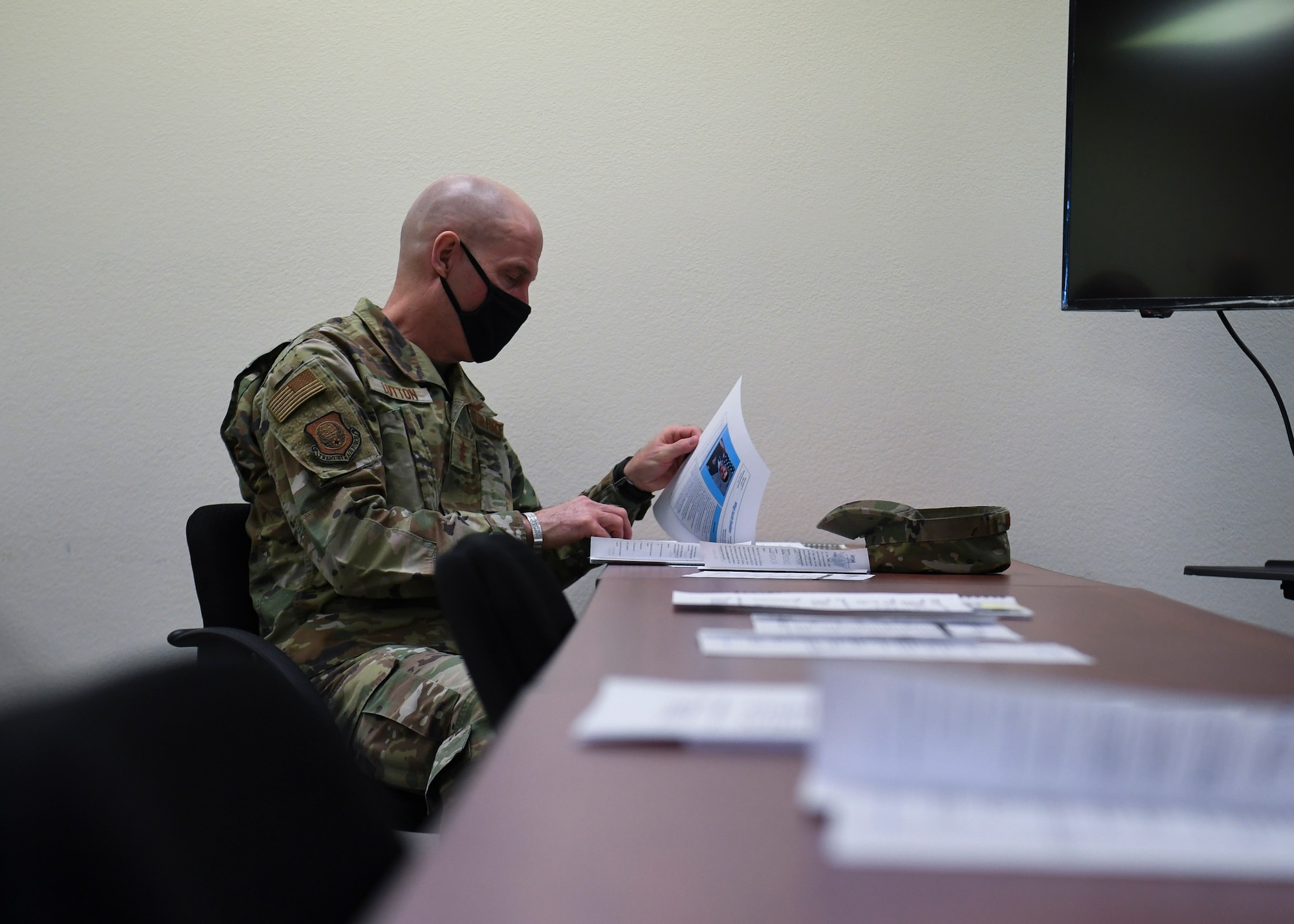 U.S. Air Force Maj. Gen. Michael J. Lutton, 20th Air Force commander, reviews documents.