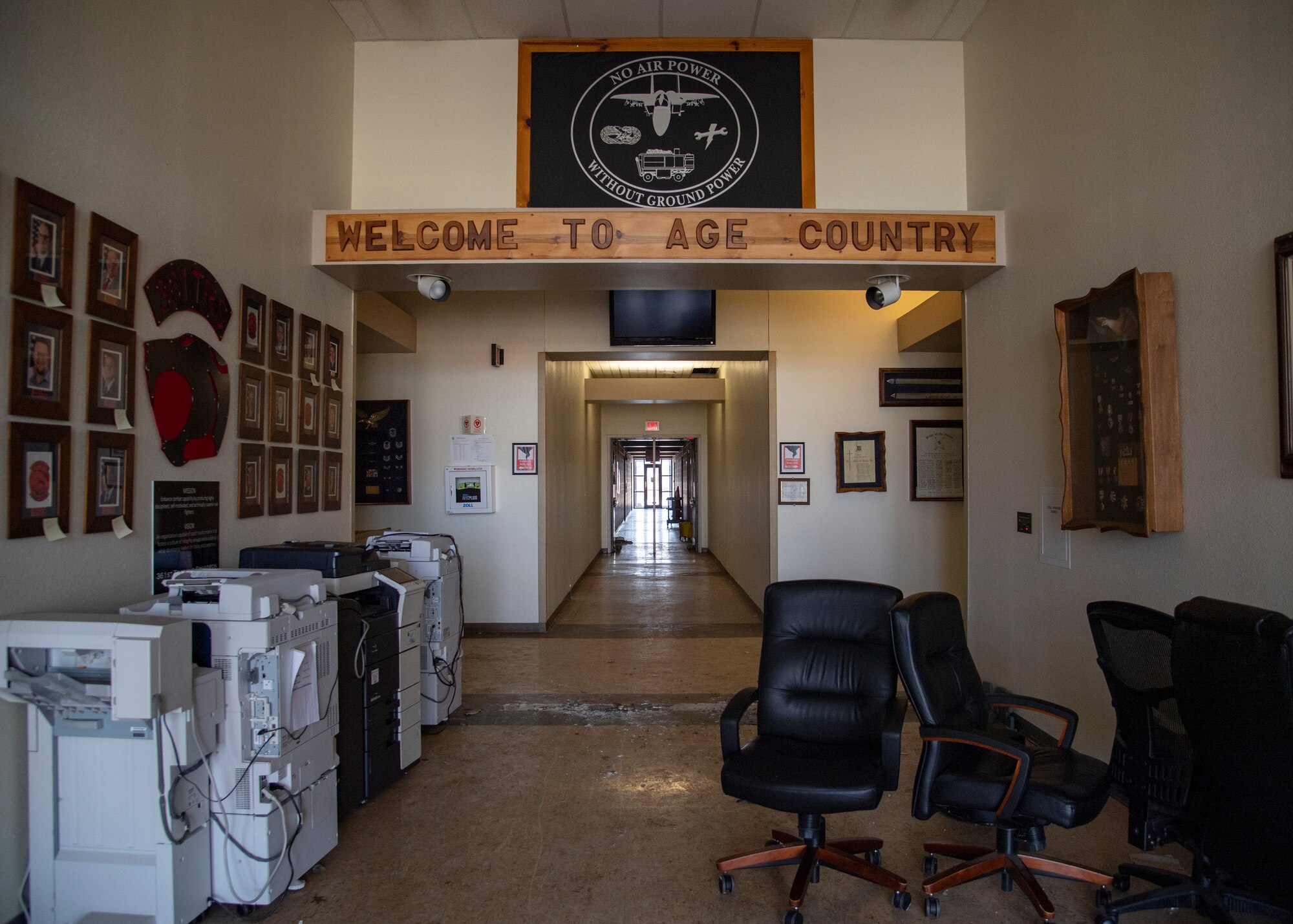 Items are placed near the front door of the 361st Training Squadron's Aerospace Ground Equipment schoolhouse at Sheppard Air Force Base, Texas, March 4, 2021. The AGE schoolhouse was flooded after pipes burst due to the snowstorm that hit Texas Feb. 14, 2021. When personnel were allowed to access damage on Feb. 19, they found four inches of water flooding the main corridor of the building. They saved as much as they could and left low-priority/damaged items. (U.S. Air Force photo by Senior Airman Pedro Tenorio)