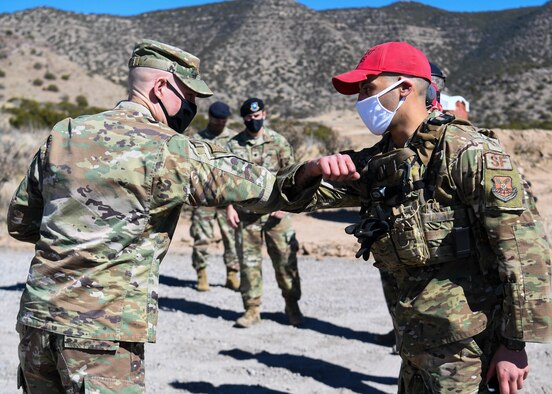 U.S. Air Force Maj. Gen. Michael J. Lutton, 20th Air Force commander, greets a defender.